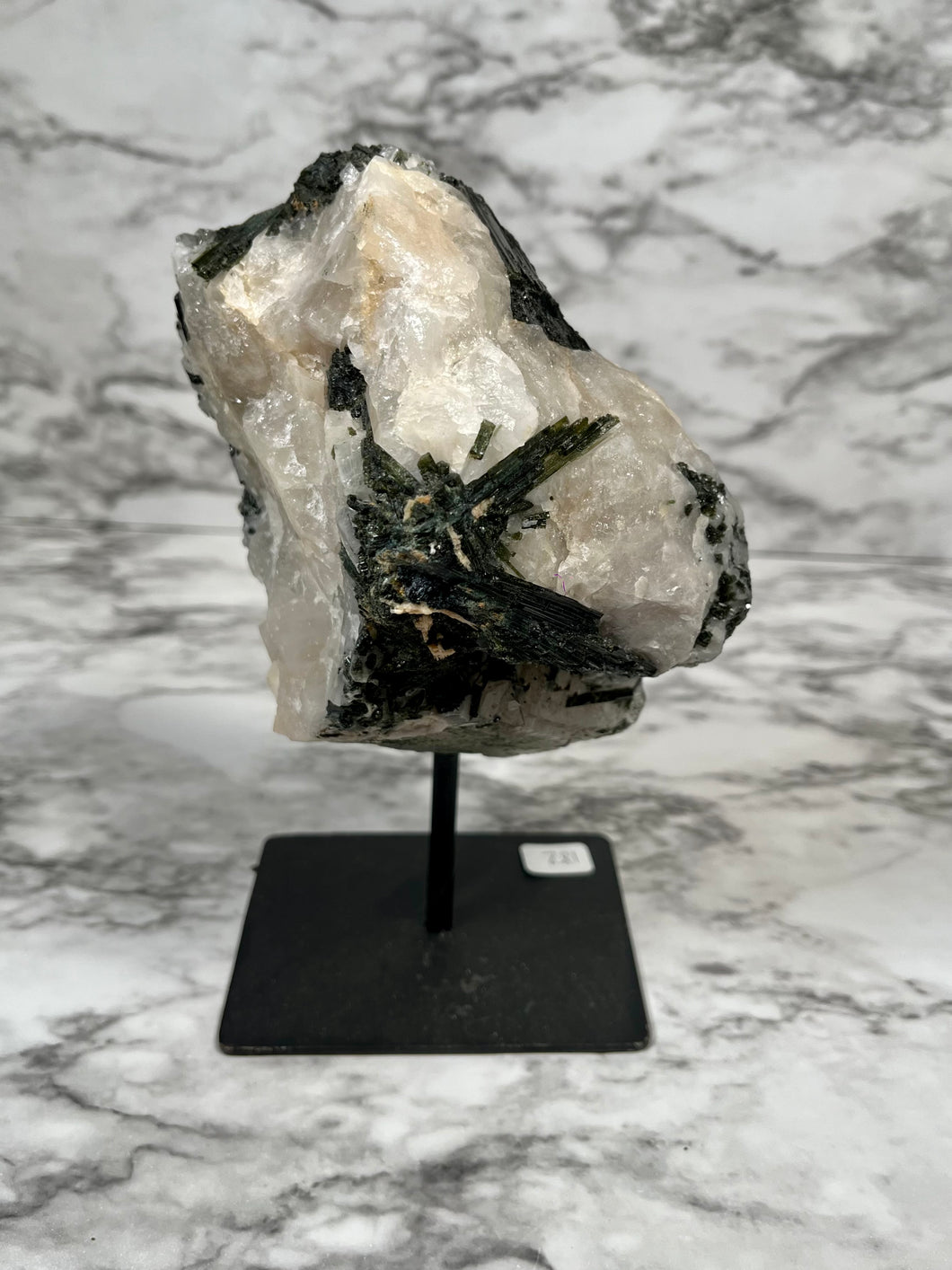 LARGE GREEN TOURMALINE IN MATRIX ON A STAND