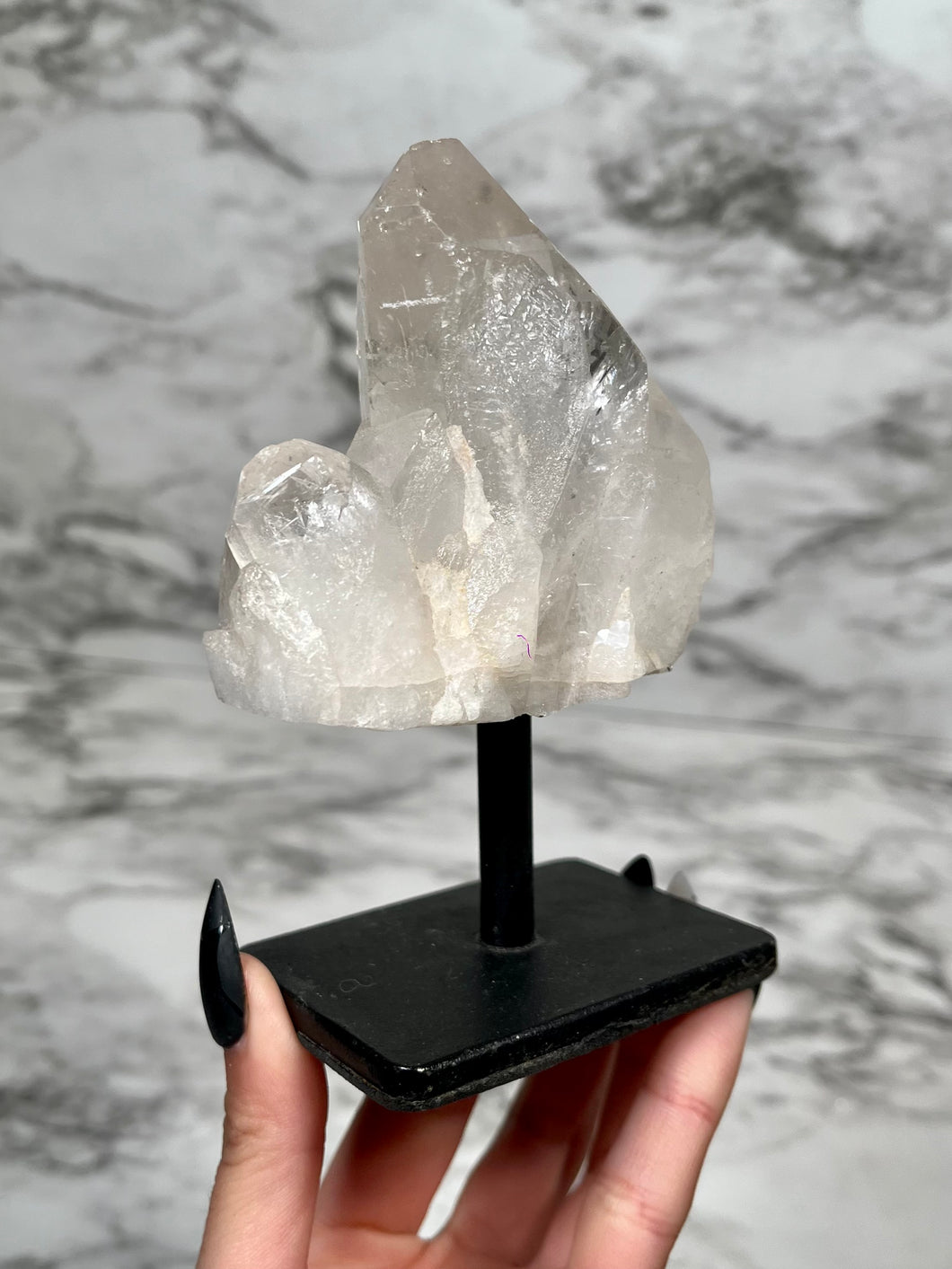 CLEAR QUARTZ POINT ON METAL STAND